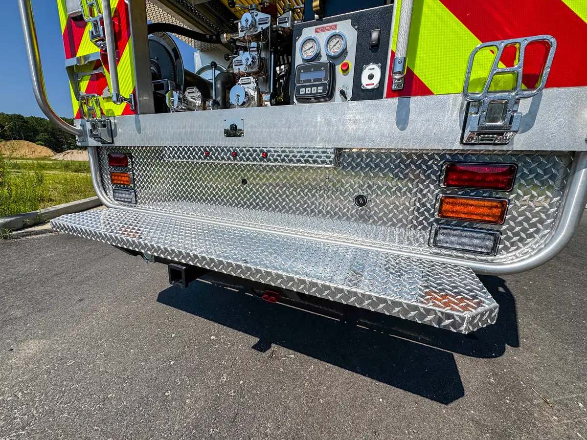 Rear underside view showing frame members and suspension behind tailboard.